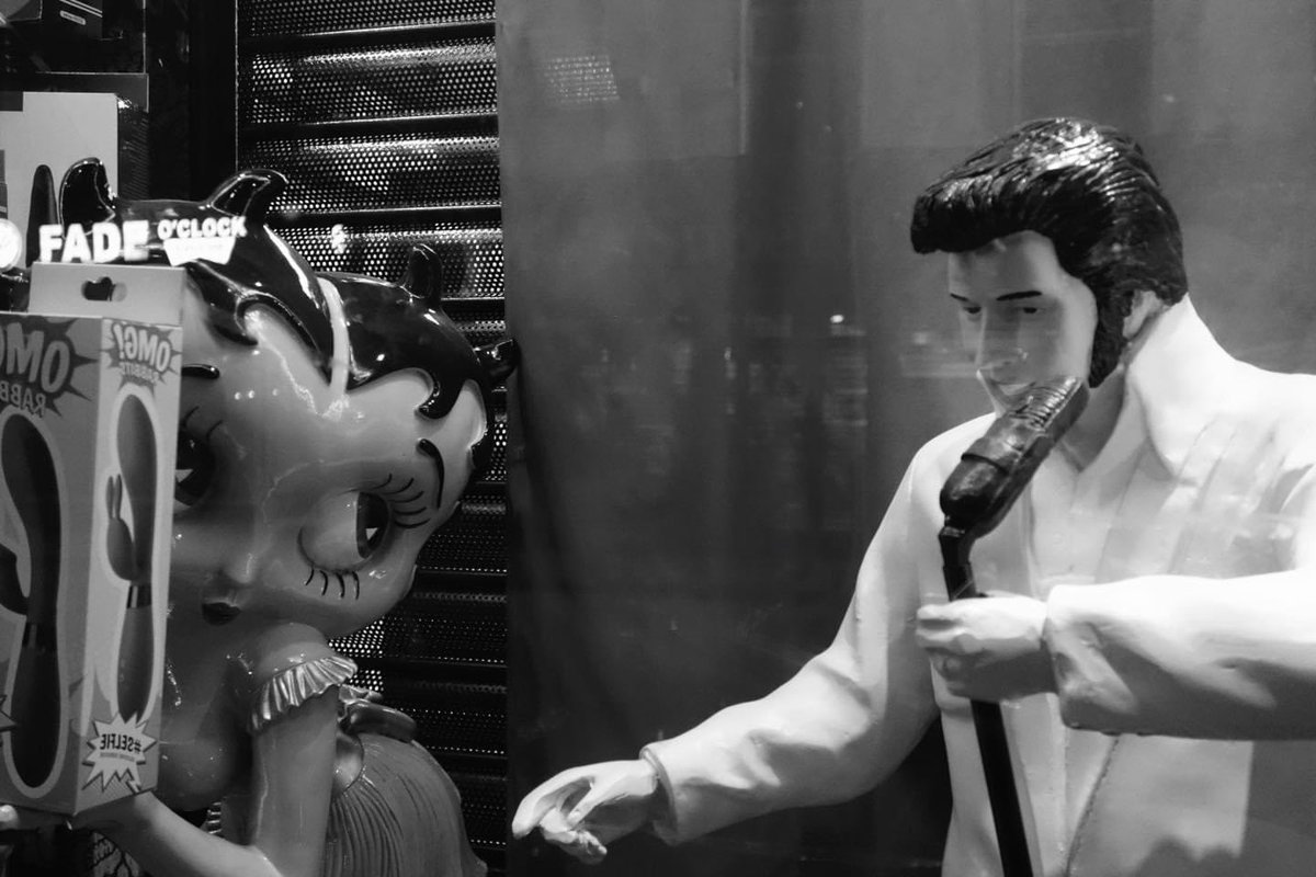 Plastic Elvis flirts with a shy plastic girl:) #dublincity #streetphotography