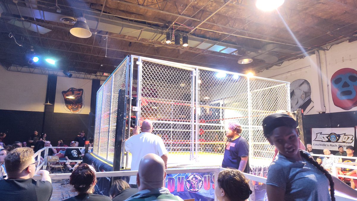 A gawd damned steel cage at the ArenA. Never thought I would see the day.