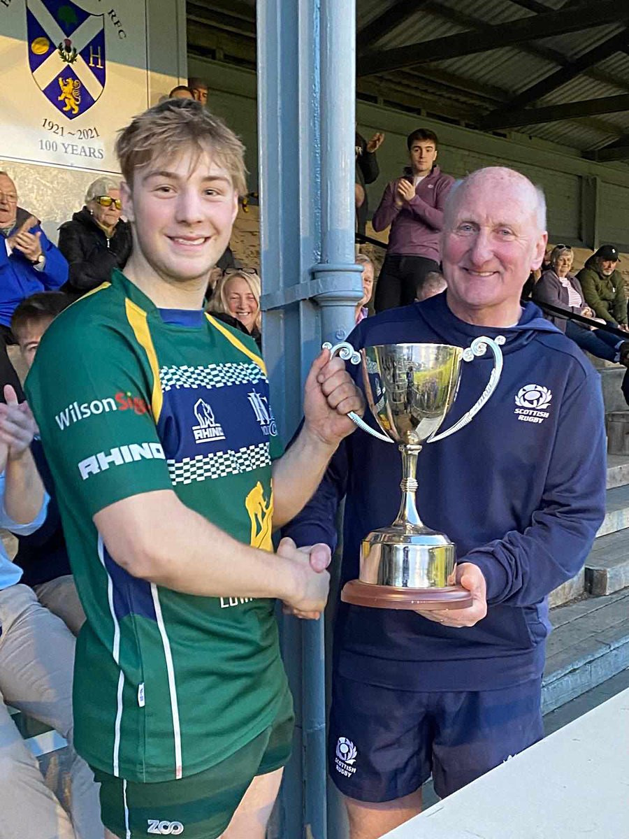 Hawick U18s Captain Jack Brown being presented with the May McAteer Memorial Trophy by John Hogg. #HawickYouthRugby