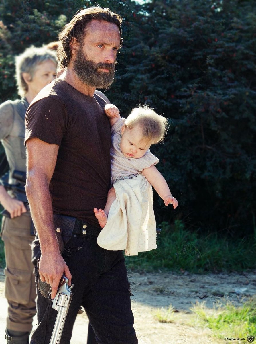 Judith is such a little badass cause her dad use to hold her like this