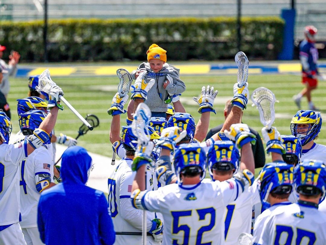 The Blue Hens have a new lucky charm 🥍 Jackson signed with his team this Spring and has been a part of a winning season for @DelawareMLAX that is not over yet - their conference tournament is up next! 📸: Ellie Bates #AllInAllTogether