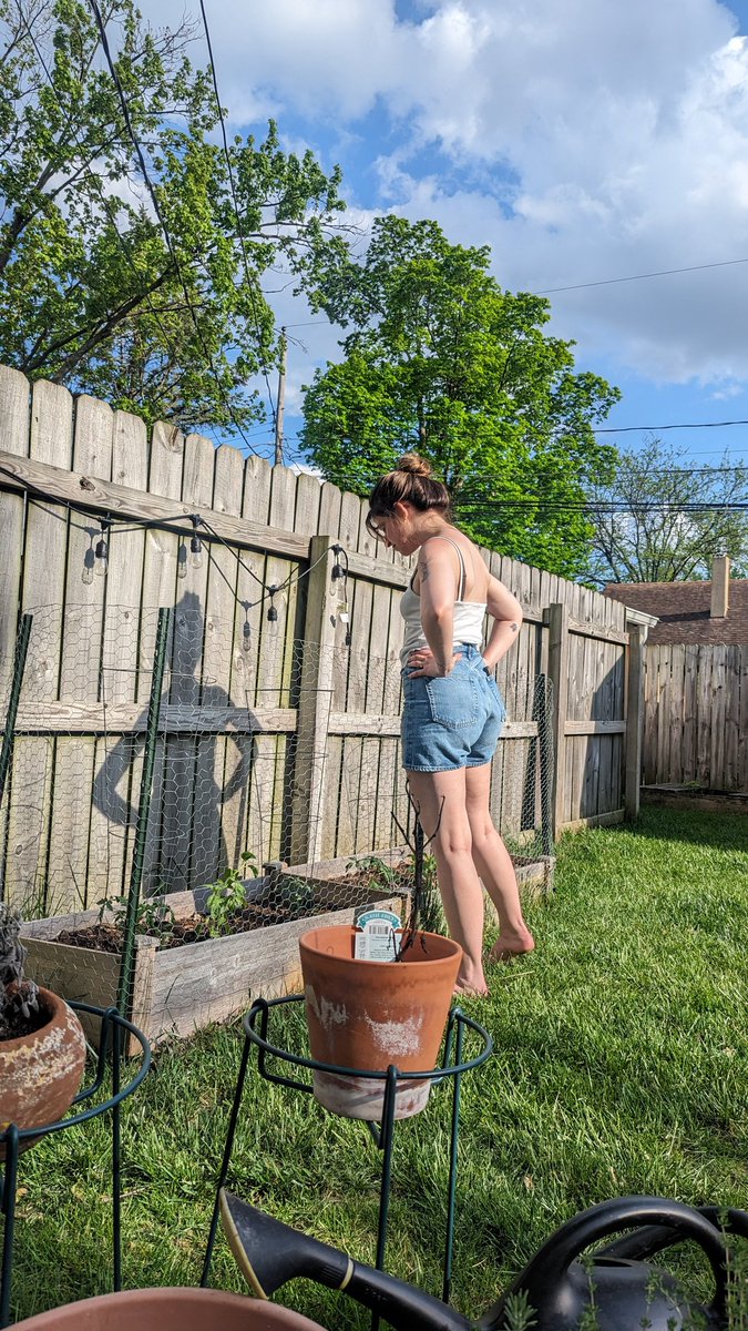 The farmer and her new tomato plants. A love beyond all love.