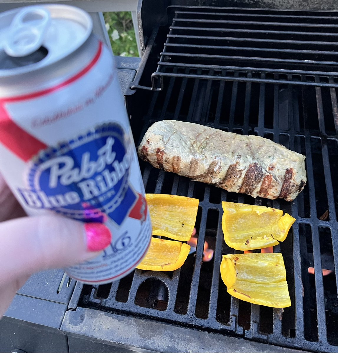 First grill of the season. Got some cheap beer, some garlic and lemon marinated pork loin, some bell pepper, some broccoli steaming inside, some Sturgill Simpson blasting on a speaker, dancing on my back porch. Life is good.