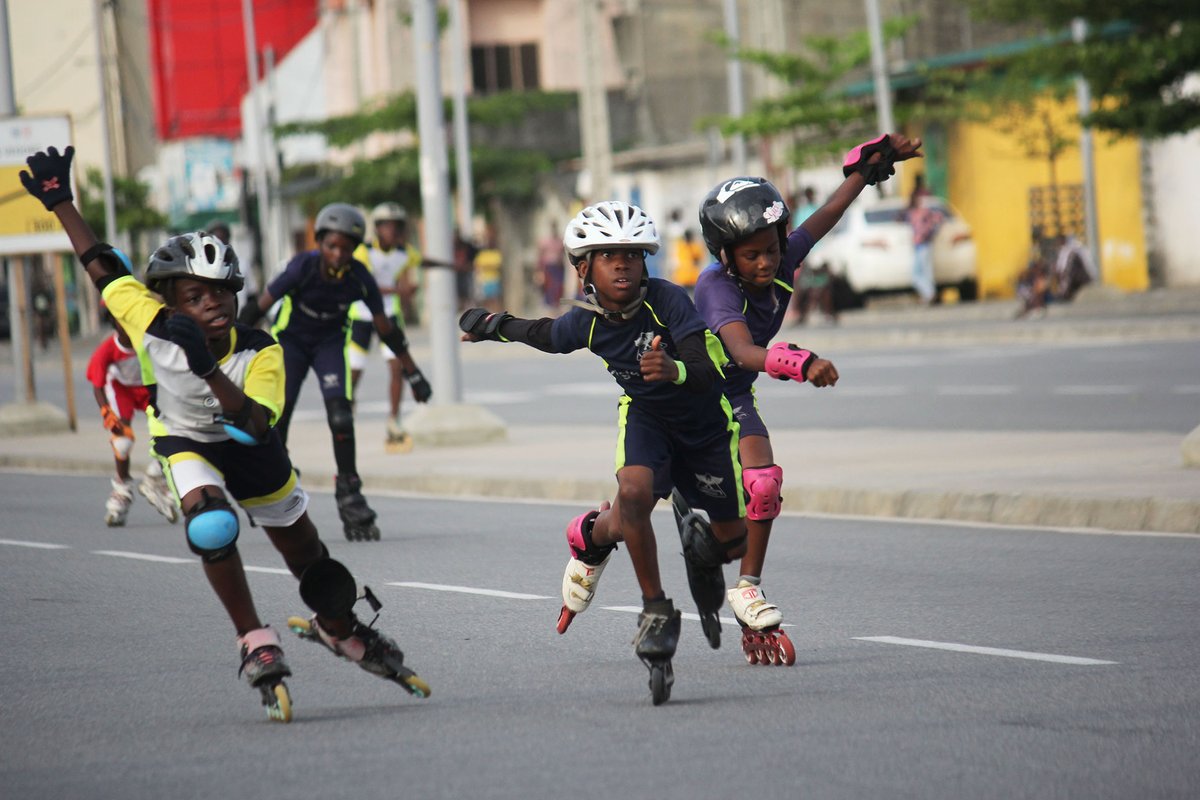 Roller skaters compete in the speed roller skating during the 62nd Challenge Cotonou Skating Open in Cotonou, Benin, on April 28, 2024. (Photo by Seraphin Zounyekpe/Xinhua)