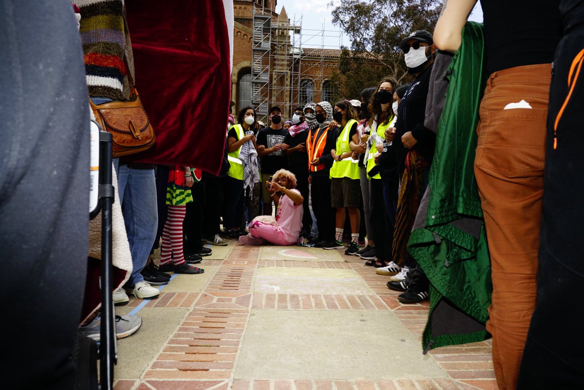 The “Peaceful Protesters” at UCLA pushed me and held blankets over my face. They tried to shove me out of the space. When that didn’t work, they linked arms and tried to push me out as a group. I sat down and refused to leave. They violated my civil rights. #UCLA #Protesters