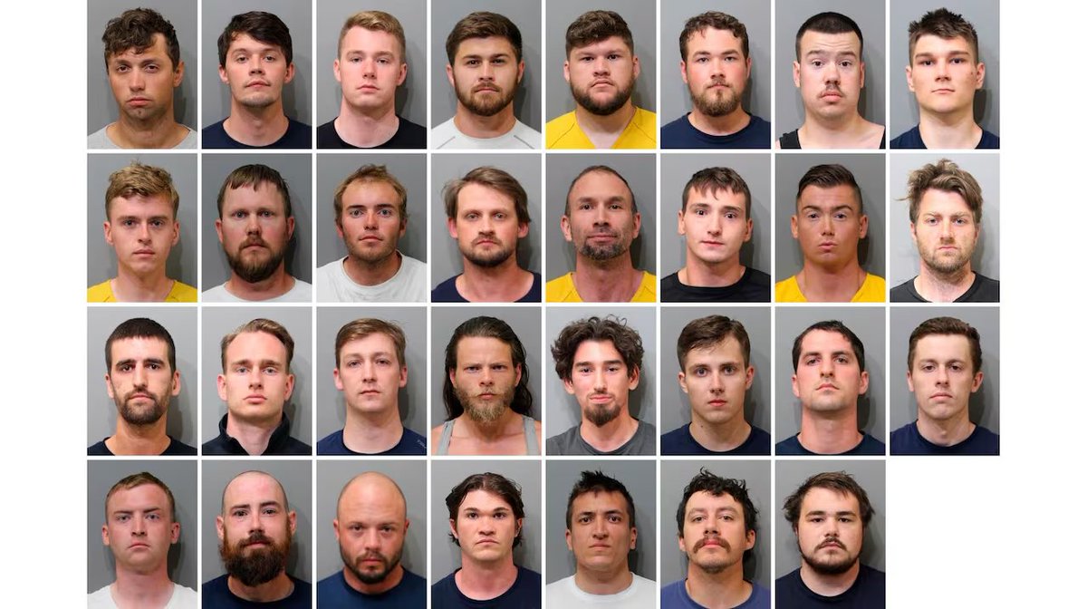 This video shows 31 masked members of the white supremacist group Patriot Front being arrested in Idaho in 2022. Unmasked mug shots and names of all of them were subsequently released by police. It certainly wasn't a 'Fed psyop'.