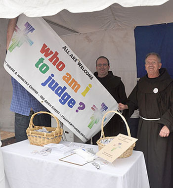 c54587's tweet photo. Franciscan friars at their Boston 'gay' Pride booth https://t.co/tHUBmvDMGC