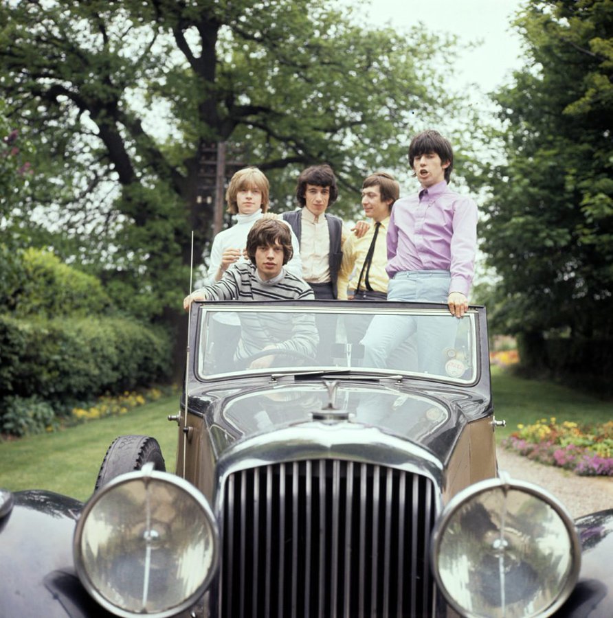 The Rolling Stones photoshoot in a vintage car, 1964. Photo by Michael Ward / Getty Images