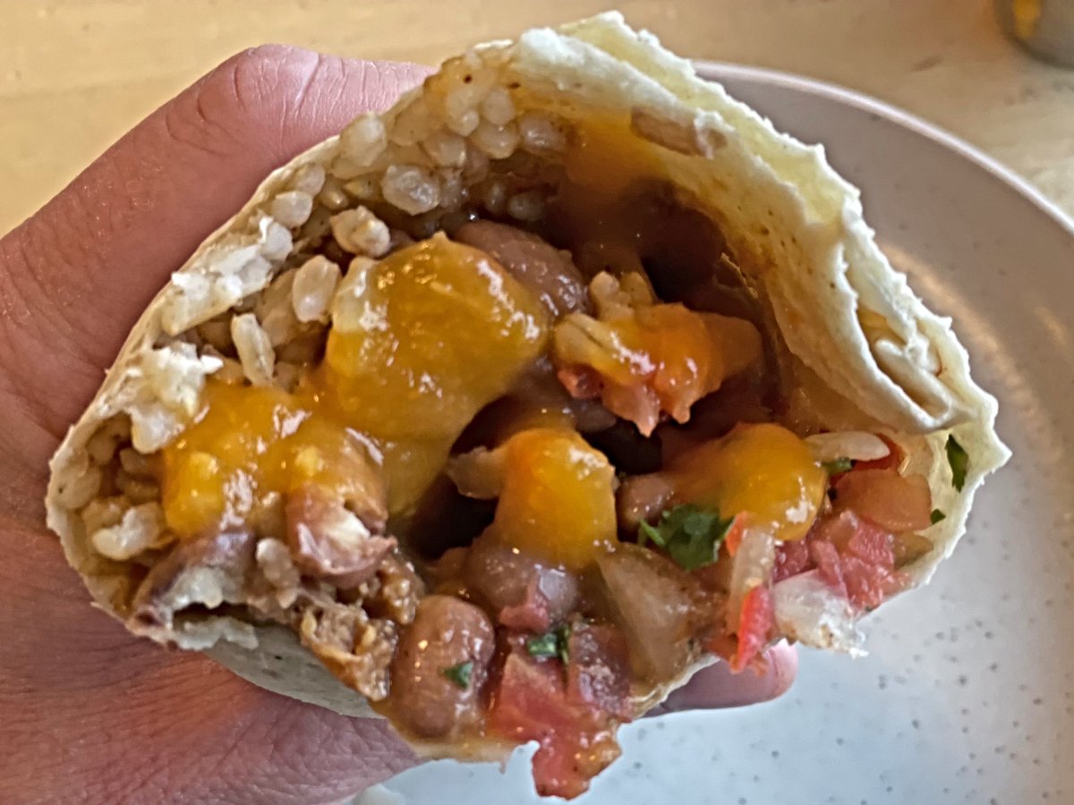 The Grilled Chicken Burrito made Vegan, with Habanero Mango Salsa, at Laughing Planet, a #Vegan Friendly Restaurant in PDX; Grilled #Tempeh, Smart Pinto Beans, Brown Rice, #VeganCheese, & Pico De Gallo! #veganburrito #veganmexicanfood #cheeze #veganmeat #laughingplanet #veganfood