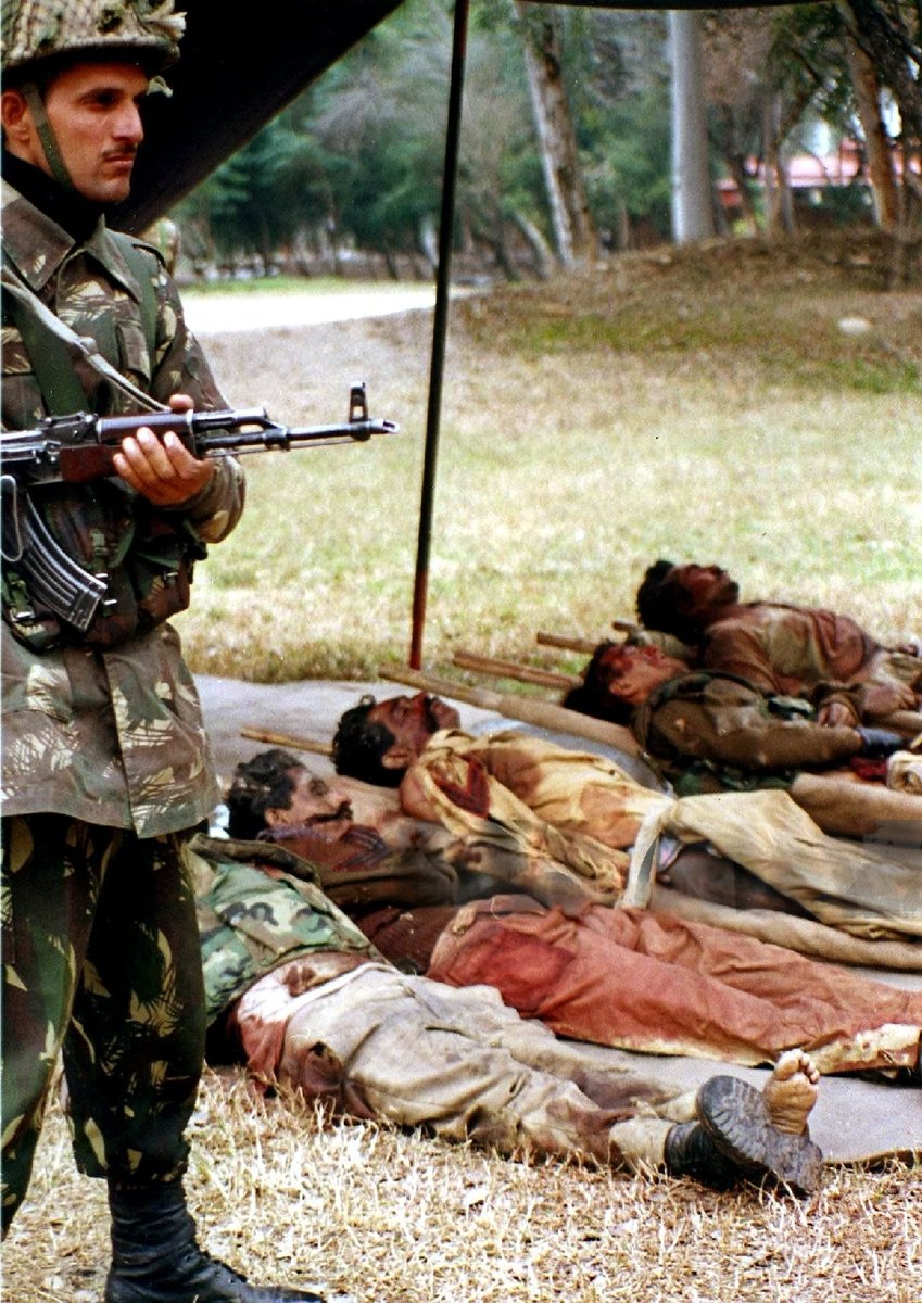 Indian soldier with the bodies of Pak Army troops after SF chaps raided a post in the Iftikharabad sub-sector in the Chamb area in January 2000. Seven Paki soldiers were captured, tied & dragged down ravines in retaliation for the loss of Lt Saurabh Kalia & 4 soldiers of 4 Jat