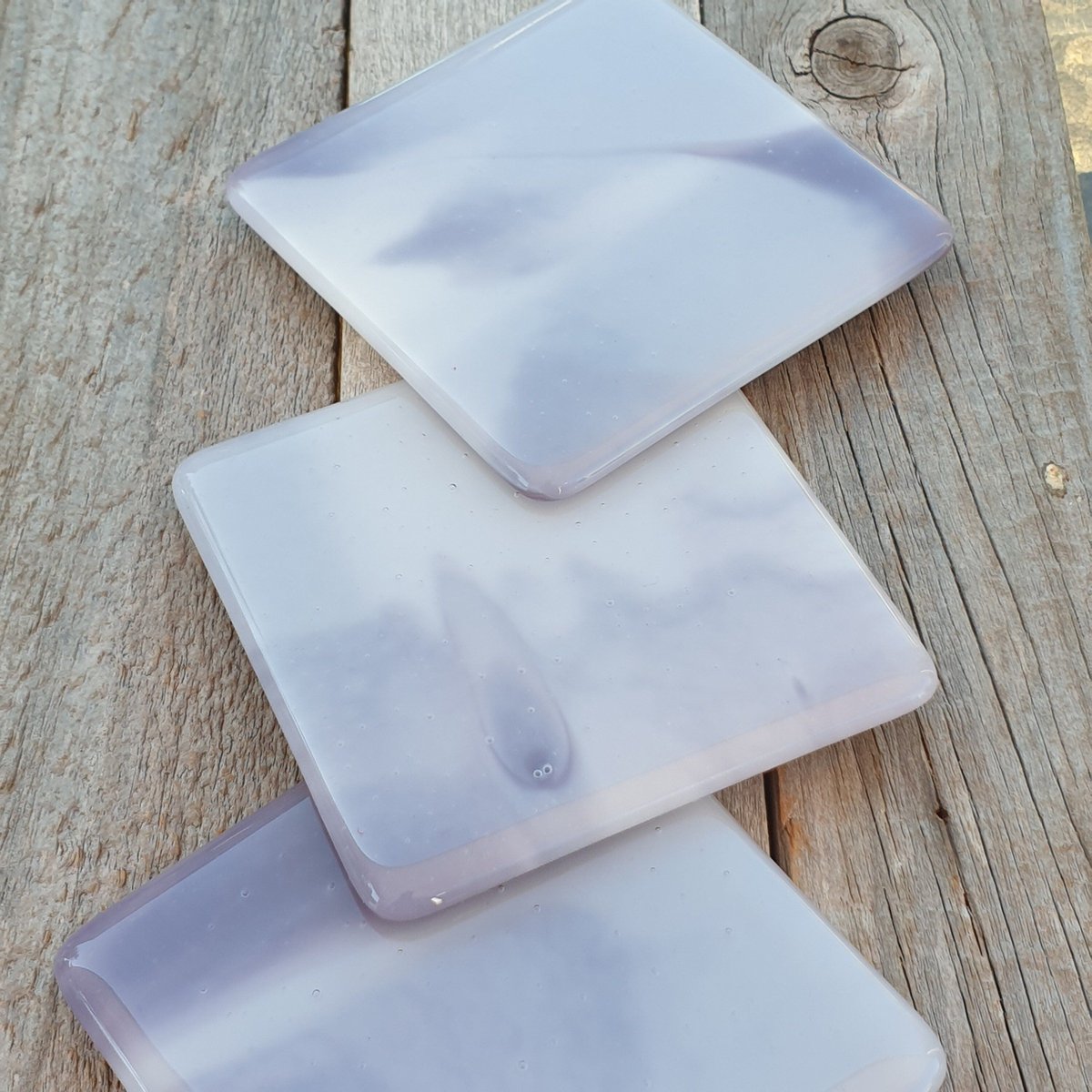 Stunning misty greys and lavender colours within these handcrafted fused glass coasters. Wonderful unique glass coasters. Perfect for a coffee table. #earlybiz #handmade #homedecor #etsy #shopindie #giftideas buff.ly/3PpBb0n