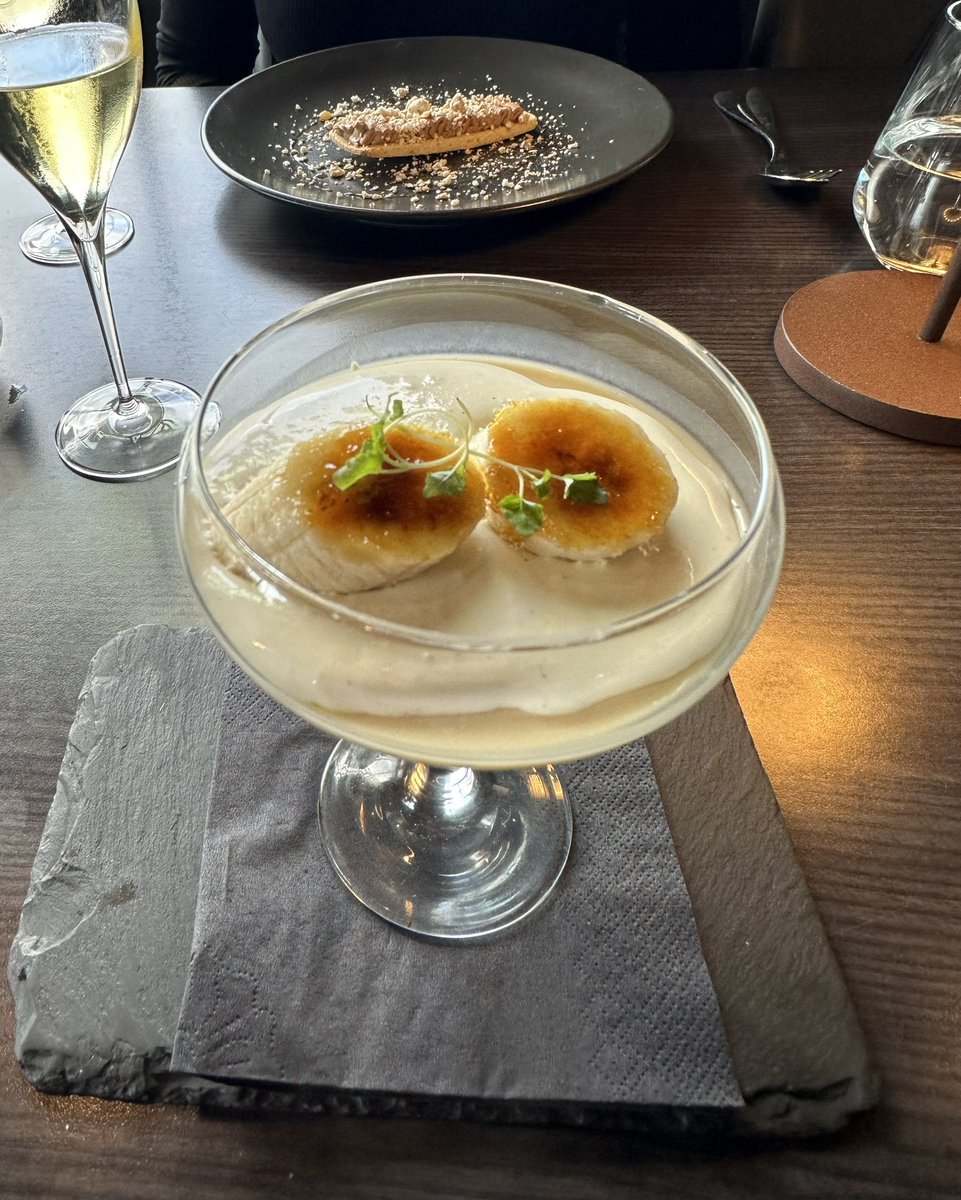 I don’t usually go for a dessert, but when I saw this come out of the kitchen and go to another table, I thought, I’ll have to try it! 

Caramel panna cotta, brûlée banana, chantilly, brown sugar biscuit, paired with a young Sauternes.