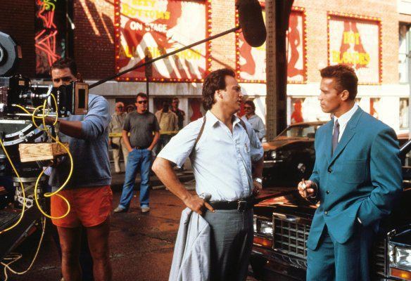 Jimmy Belushi and Arnold Schwarzenegger on the set of RED HEAT (1988).