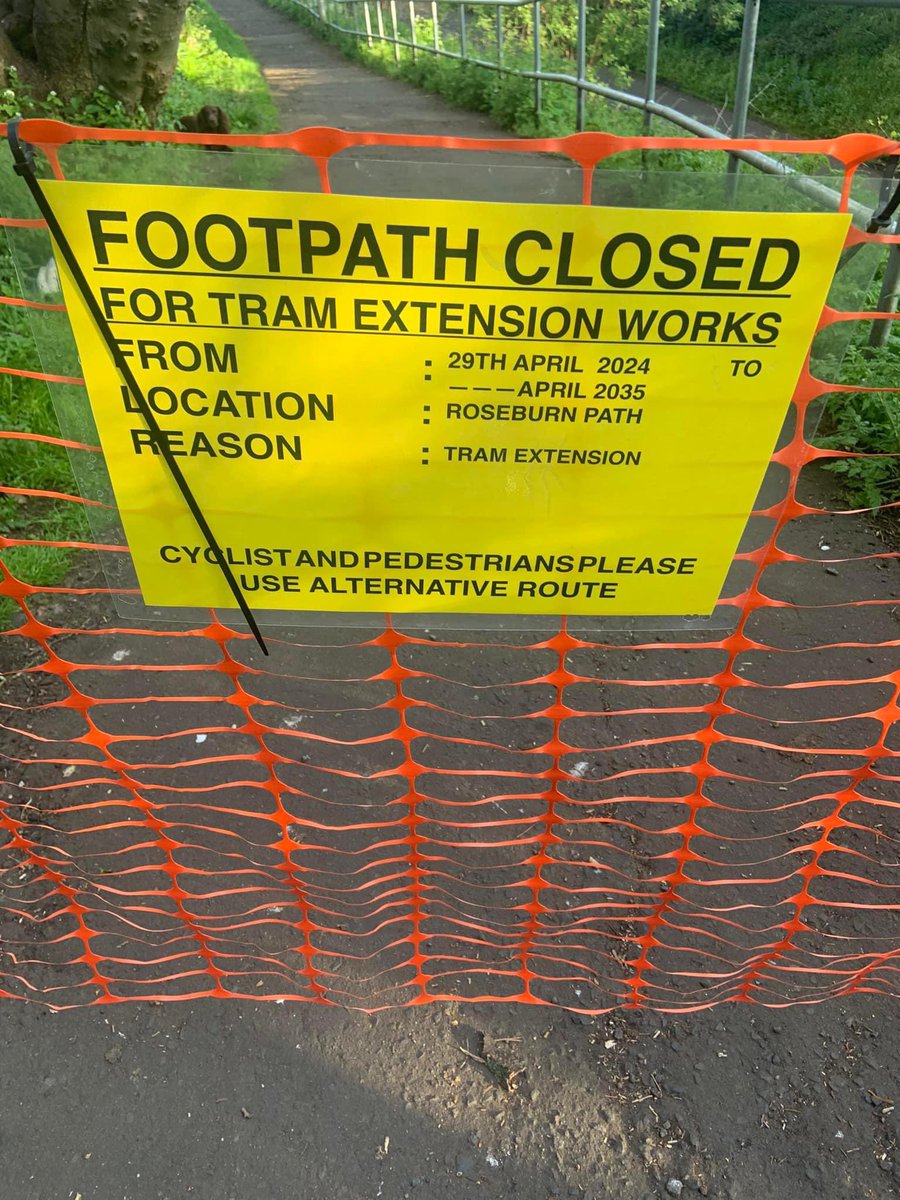 Protesting the potential (temporary) closure of section of the Roseburn Path for tram works by… closing the path (fake sign). Intellectually inconsistent; folks who have encountered this will have had to route around. Poor show. Action disowned by Save The Roseburn Path group.
