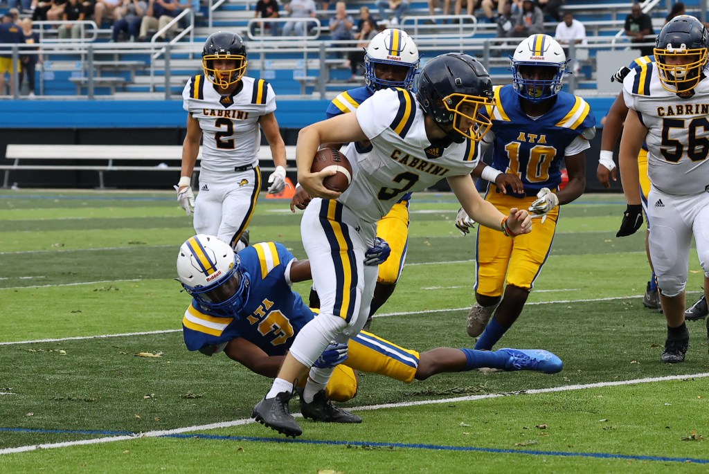 Cabrini’s Nicholas Baccella signs on the play football at Adrian College trib.al/N87iEcw