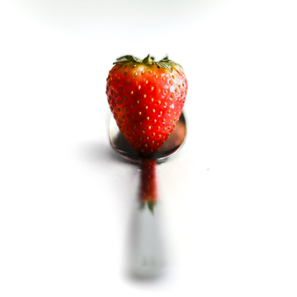 testing out a new toy - finally bought a full frame camera so here is a picture of a strawberry on a spoon #fsprintmonday #Sharemondays2024
