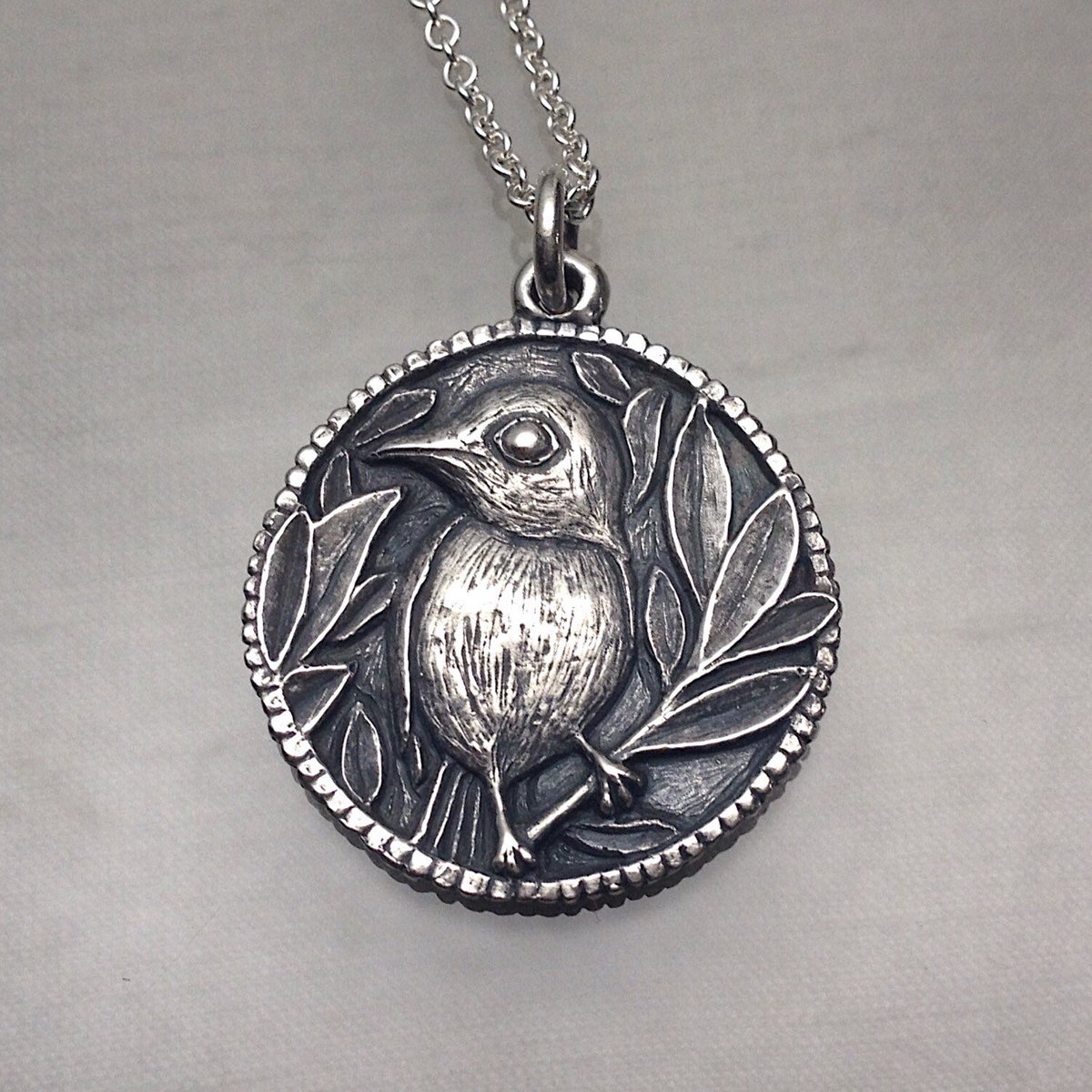 Little Bird Perched pendant, such a cutie. It’s available in my shop.🩷 carrienunes.etsy.com/listing/250180… #makingart #birb