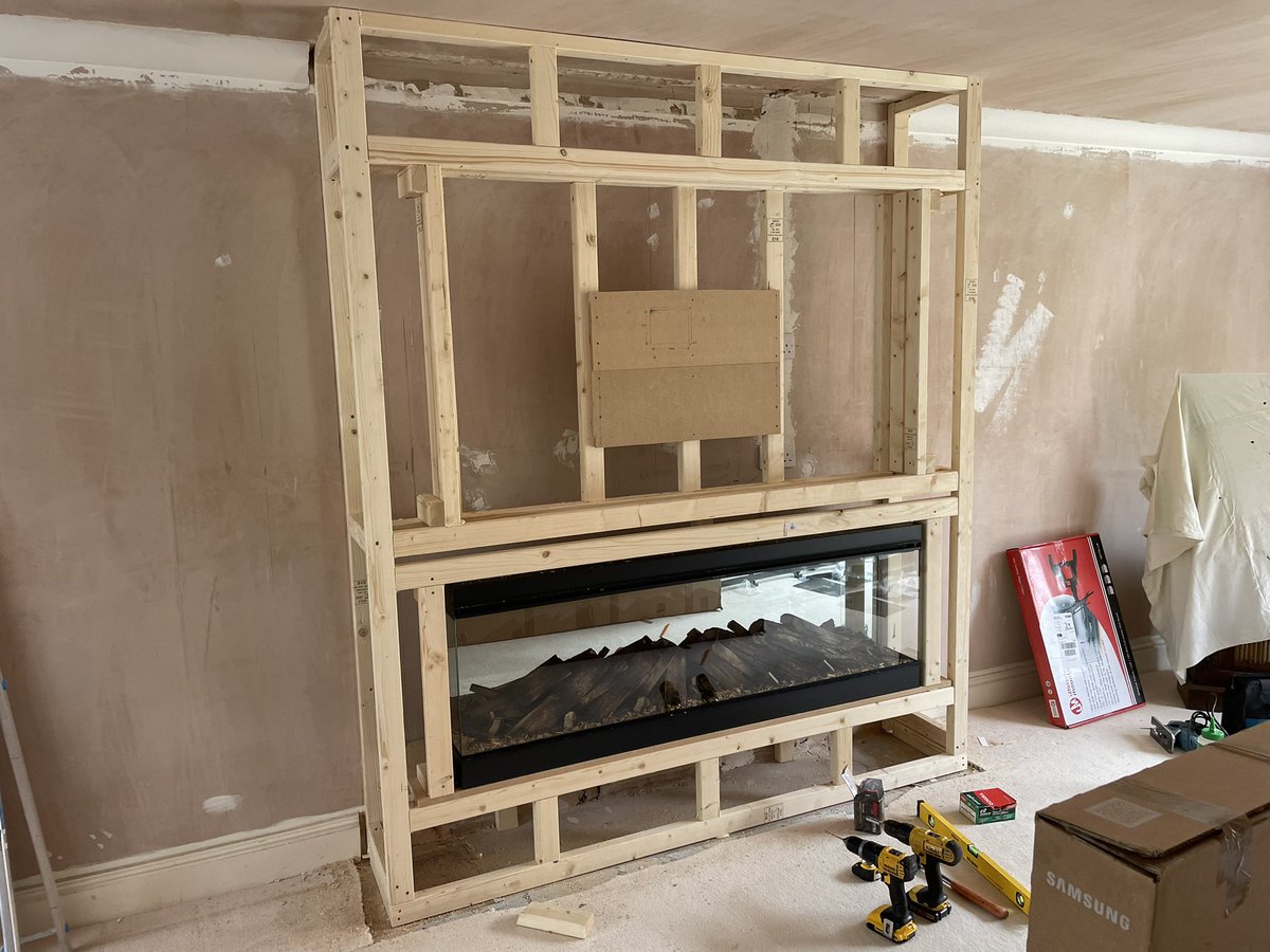 Nice simple media wall with 65” samsung tv and electric fire, all woodwork, design and build by home iQ, turning a standard lounge into a nice eye catching feature.