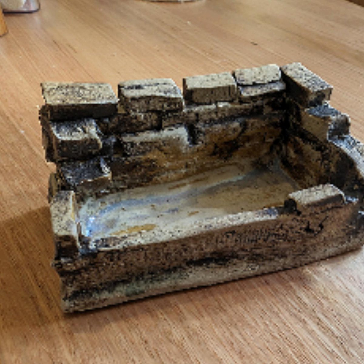 So at pottery I had this idea to make a little tray and build up an old looking brick wall to grow wheatgrass or whatever microgreens. I figure it might look cool like grass is growing through ruins. I loaded it up yesterday so we'll see if it works out.