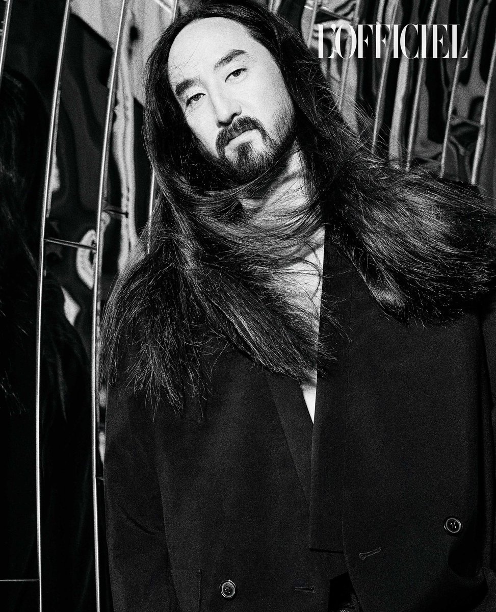 Where legends are forged in the heart of Los Angeles, our Hommes Cover Star for April Edition, Steve Aoki forged his legacy. His label isn’t just about music; it is a portal to alternate dimensions—a place where beats collided, and genres swayed a frenetic tango.