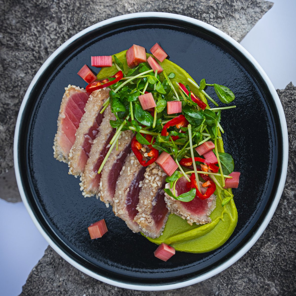 From our spring menu:

Tuna: With a crispy rice crust, nestled in miso pea puree, with accents of pickled rhubarb and fresno chile.

#gorockford #finedining #rockfordil
