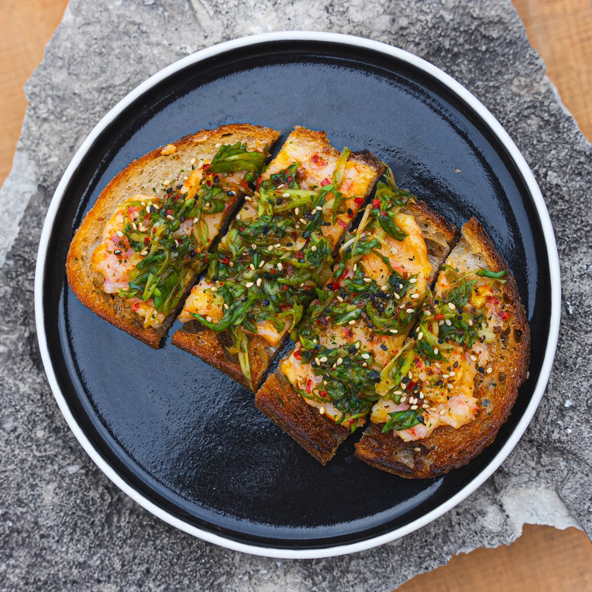 From our spring menu:

Shrimp Toast: A fusion of flavors on Crust & Crumble sourdough, with zesty gochugaru scallion salad and a sprinkle of furikake.

#gorockford #rockfordil #rockfordilrestaurants