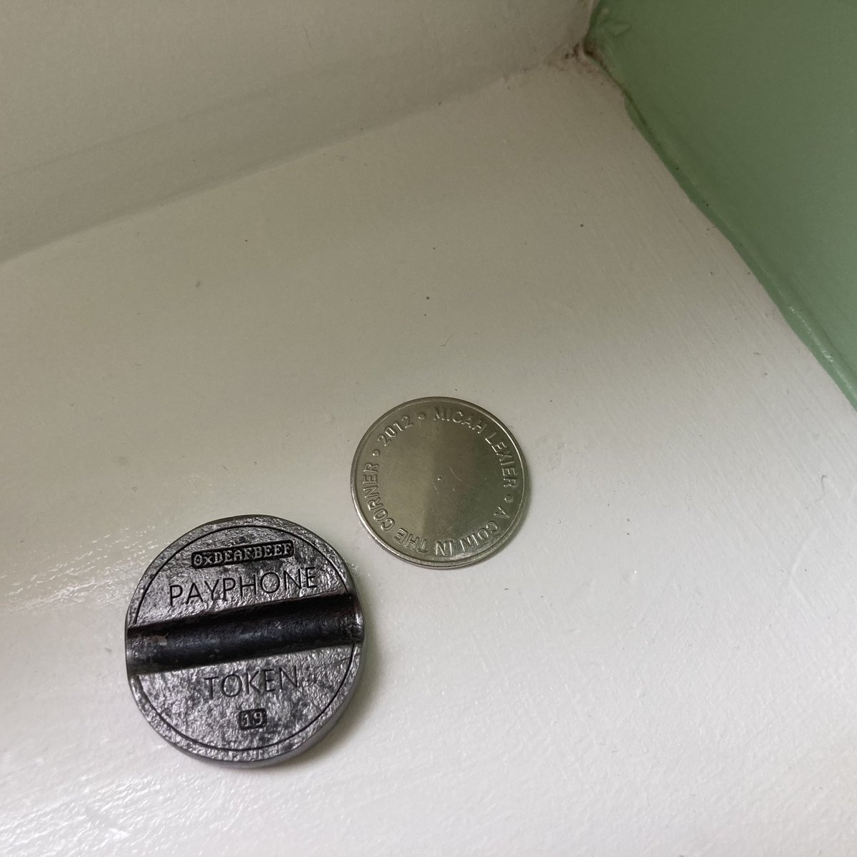 Payphone Token by @_deafbeef , 2024; “A Coin In The Corner” by Micah Lexier, 2012 The first “minted” artwork I ever acquired, and the most recent. Together at last in an inconspicuous corner of my house.