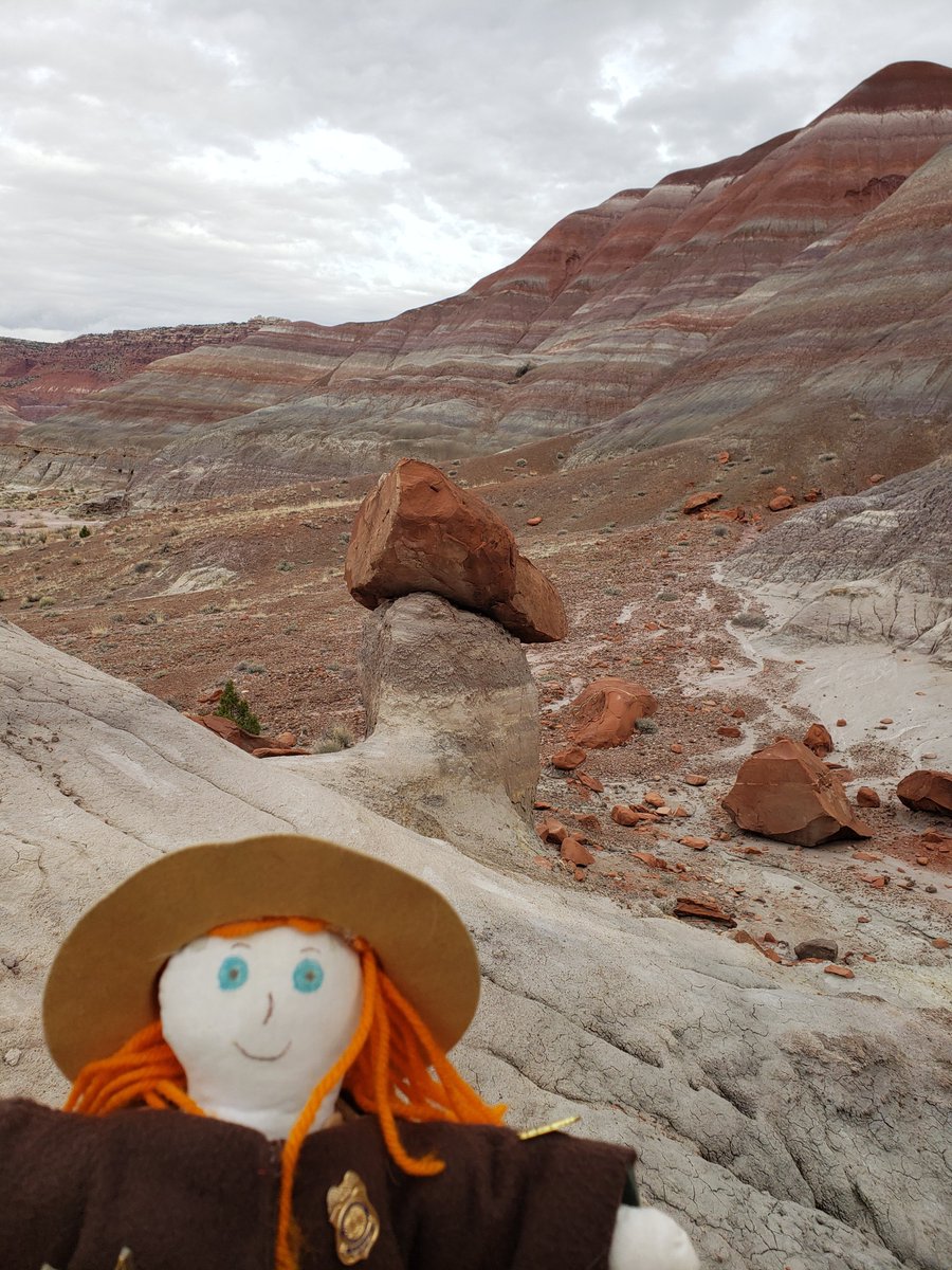 Ranger Sarah found a Cap Rock while exploring the Rainbow Mountains. Caprock is a geological term used to describe a harder or more weather resistant layer of rock overlying a softer or less weather resistant layer of rock. — at Grand Staircase-Escalante National Monument.