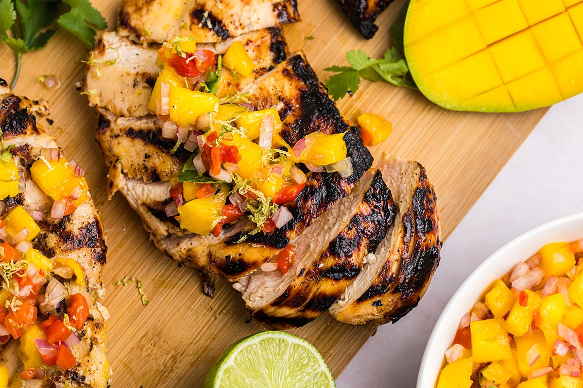 Using a simple marinade with flavors of mango, coconut, ginger, and citrus, this Grilled Mango Chicken cooks is a must for summer cookouts! RECIPE: savoryexperiments.com/grilled-mango-…