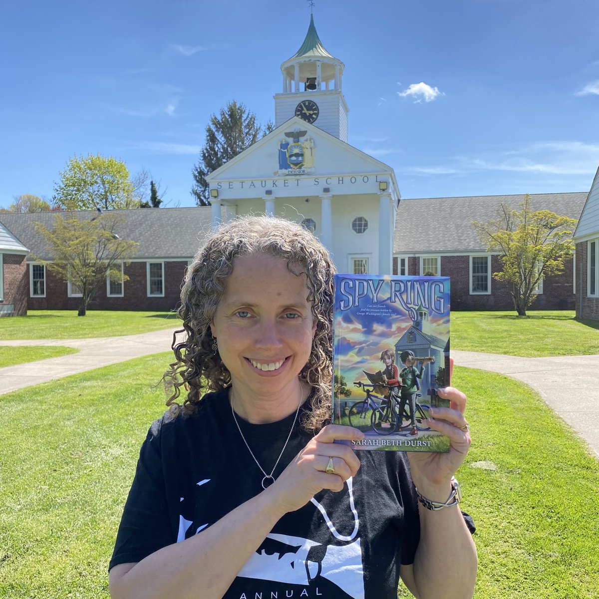 Look what arrived in the mail! A lovely finished copy of my new kids book, SPY RING!!! I just had to take its picture with the school that's in the book, Setauket Elementary! So excited to share with readers! Out 5/21/24 from @ClarionBooks! @AHedit