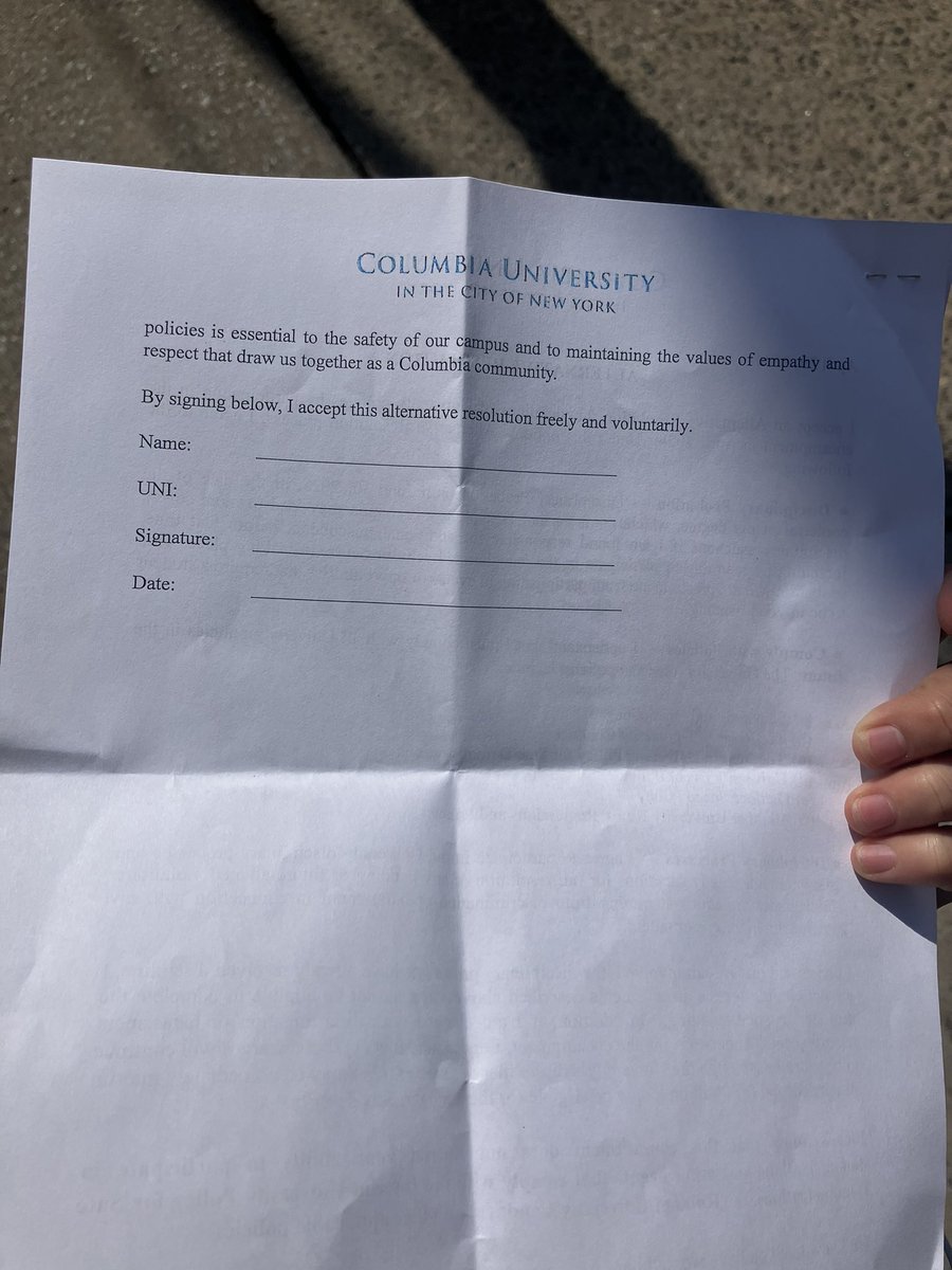 The university distributed the sheet below this morning, telling students to disperse by 2 p.m. today or face interim suspension. On interim suspension, students who remain on the West Lawn will be trespassing.