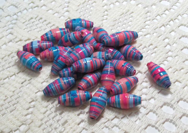 Paper Beads, Loose Handmade Jewelry Making Supplies Craft Supplies Hand Colored, Barrel Pinks and Blues thepaperbeadboutique.etsy.com/listing/165632…  #handcoloredpaperbeads #handmadebeads #handmadesupplies #jewelrymakingbeads #craftingbeads