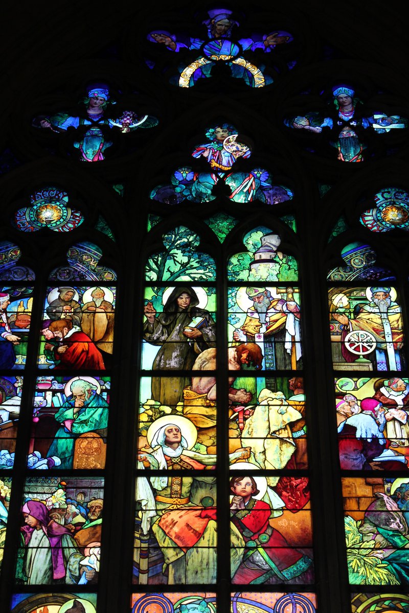 Later on came Art Nouveau's injection of creativity. It built wonders like the Municipal House, but splashes of it are found everywhere. It filled unlikely places, like this 1930s window in St Vitus Cathedral...