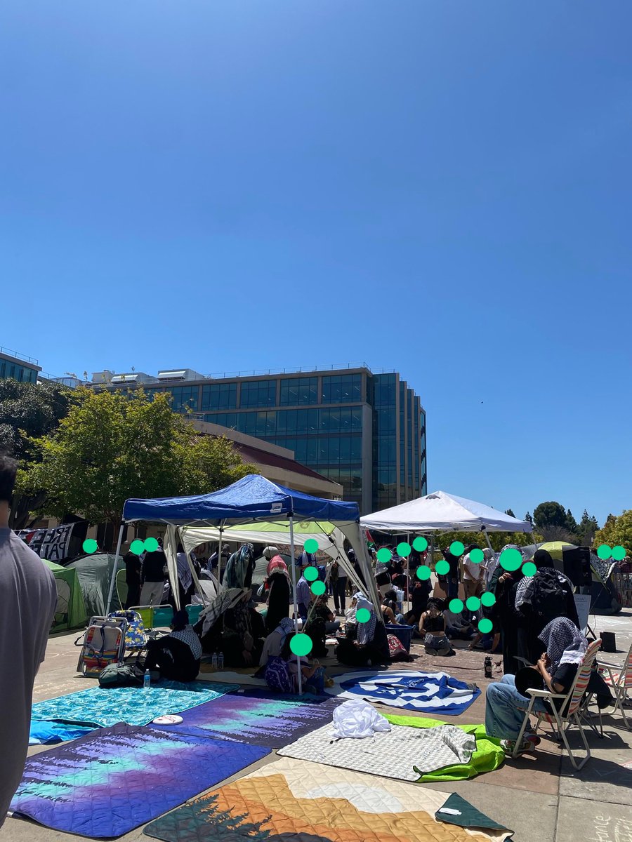RankandFileUCI's tweet photo. We have FIVE police forces present at our UCINTIFADA Liberated Zone: UCI PD, Irvine PD, Costa Mesa PD, Newport Beach PD, and OCSD. Jail busses are pulling up. The threat? A beautiful liberated zone committed to solidarity and community. Our programming continues🤎 https://t.co/ak1V0Nrcy0