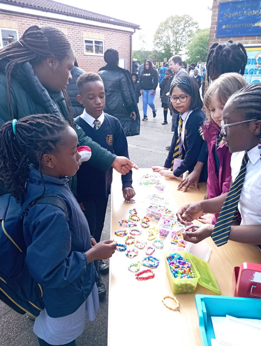 Our fantastic Year 6 bracelet sellers opened their stall today. They have spent their lunchtimes over the past year making bracelets for @CAFOD. They will be selling each day this week after school!