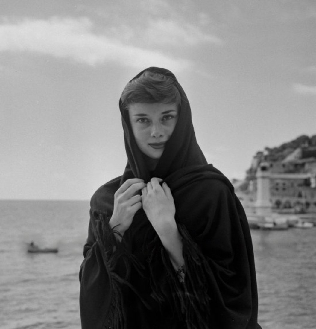 Audrey Hepburn photographed by Edward Quinn at the harbor in Monaco, 1951