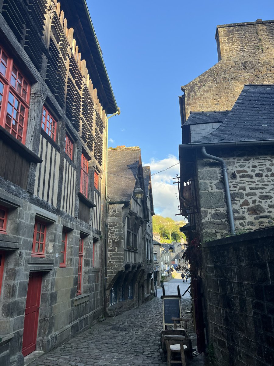 Surely one of the most beautiful city streets in the world. The Rue de Jerzual, Dinan. With exquisite half timbered houses and a medieval gate halfway. It is a perfect cloudless spring evening. And I am the only person walking the road and all I can hear is fervent birdsong