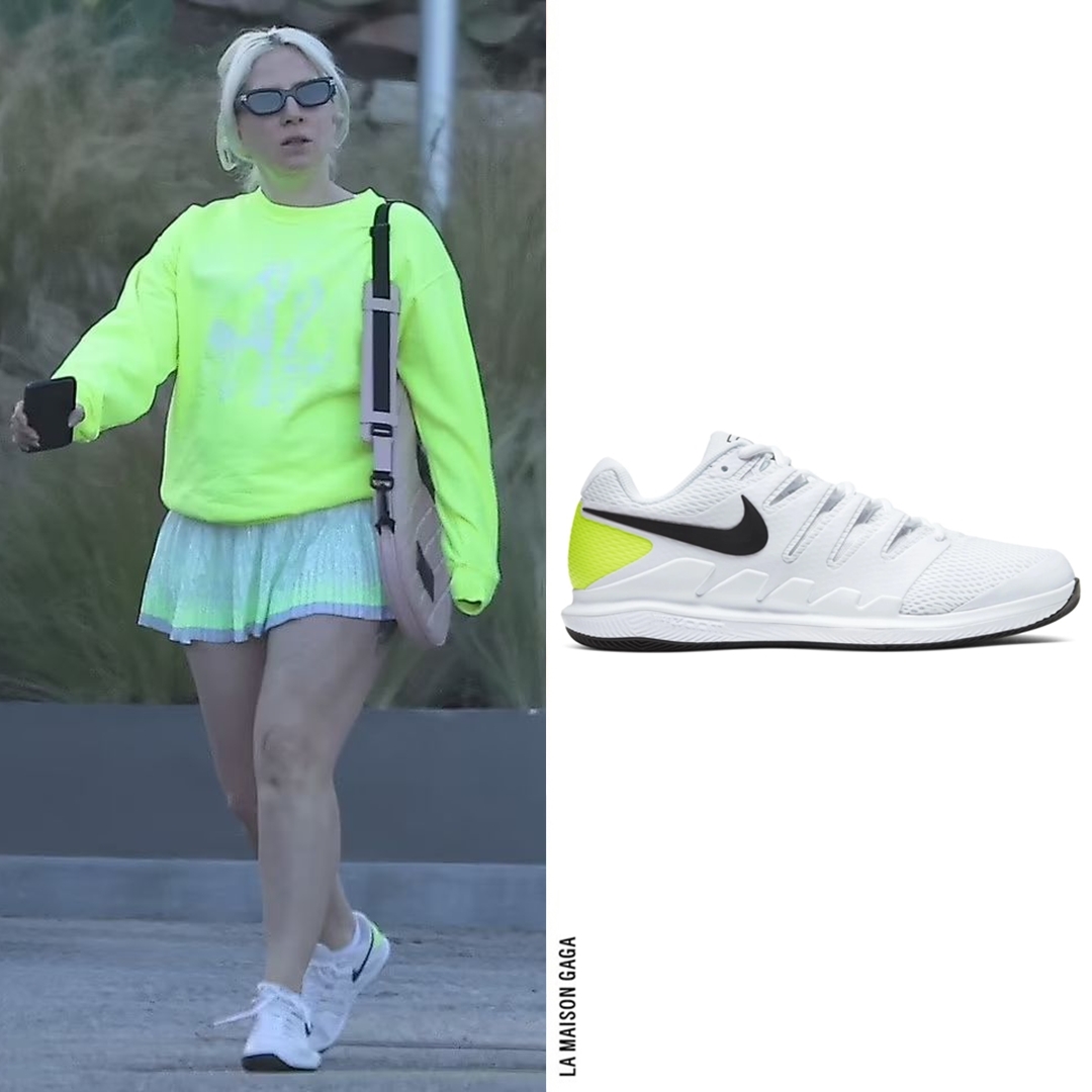 Lady Gaga got her #Challengers on, wearing a @BajaEast 'Freedom' sweatshirt, @KSwiss x @ShopLuckyinLove 'Eclipse' ombré tennis skirt, @_GentleMonster_ 'Vis Viva' sunglasses, @KillSpencer quilted tennis racket case in pink and @Nike 'Air Zoom Vapor X' sneakers.