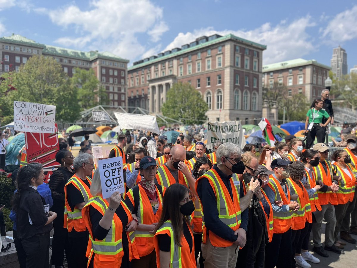 Arm in arm, faculty at Columbia University have made a blockade at the entrance of the encampment while students picket around the perimeter.