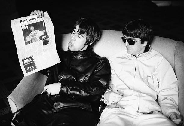 Doesn’t look like Oasis’ Liam and Noel Gallagher care much for The Stone Roses’ Ian Brown. Photo by Kevin Cummis, circa 1994