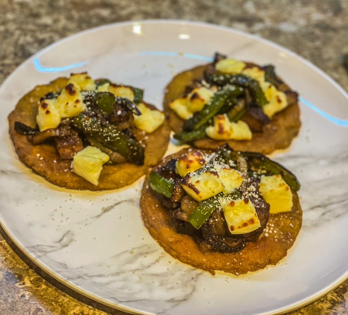Philly meets Mexico; Homemade corn tortillas with spiced ribeye, onions and peppers topped with broiled Queso Blanco and sprinkled with Cotija #cook #cookwithme #homemadefood #foodtok #homecooking #foodlovers #comfortfood #deliciousness #homemade #dinnerideas #food #tasty