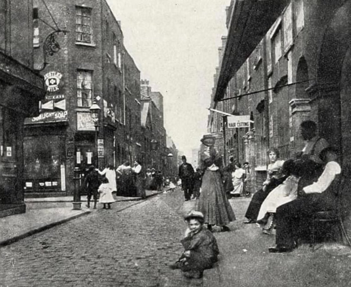 street-view of a busy road in Whitechapel, London Circa 1890s