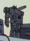 AnimArchaeology's tweet photo. What #mecha  is this on a shelf in Kamille's bedroom in Mobile Suit Zeta #Gundam  (1985)? It looks a bit like Perceptor from Transformers G1 (based on the Micro Change line) but the legs are completely wrong, and it doesn't like like anything from Gundam up to that point. https://t.co/kbxhZkcnK8