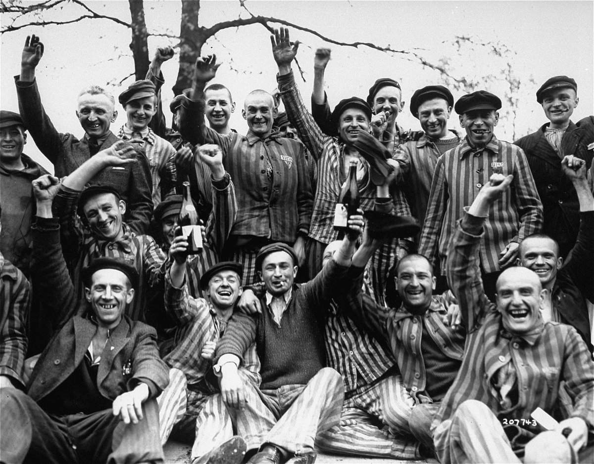 #OnThisDay in 1945, American forces liberated Dachau concentration camp. 📷: Polish prisoners in Dachau toast their liberation from the camp. Photo Credit: United States Holocaust Memorial Museum, courtesy of National Archives and Records Administration, College Park