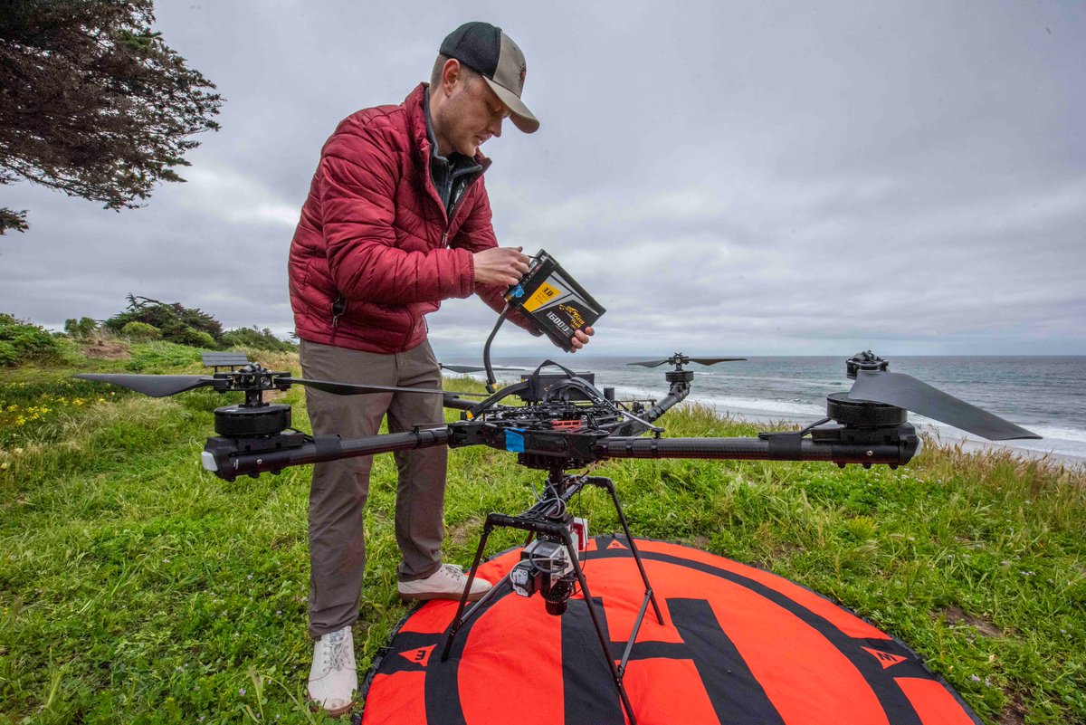 Navy Lt. Corbin Mellow prepares for a data collection flight using an unmanned aircraft system (UAS) equipped with an infrared LiDAR (Light Detection and Ranging) sensor. This UAS is supporting multiple research efforts by students at NPS. Read more: linkedin.com/posts/nps-mont…