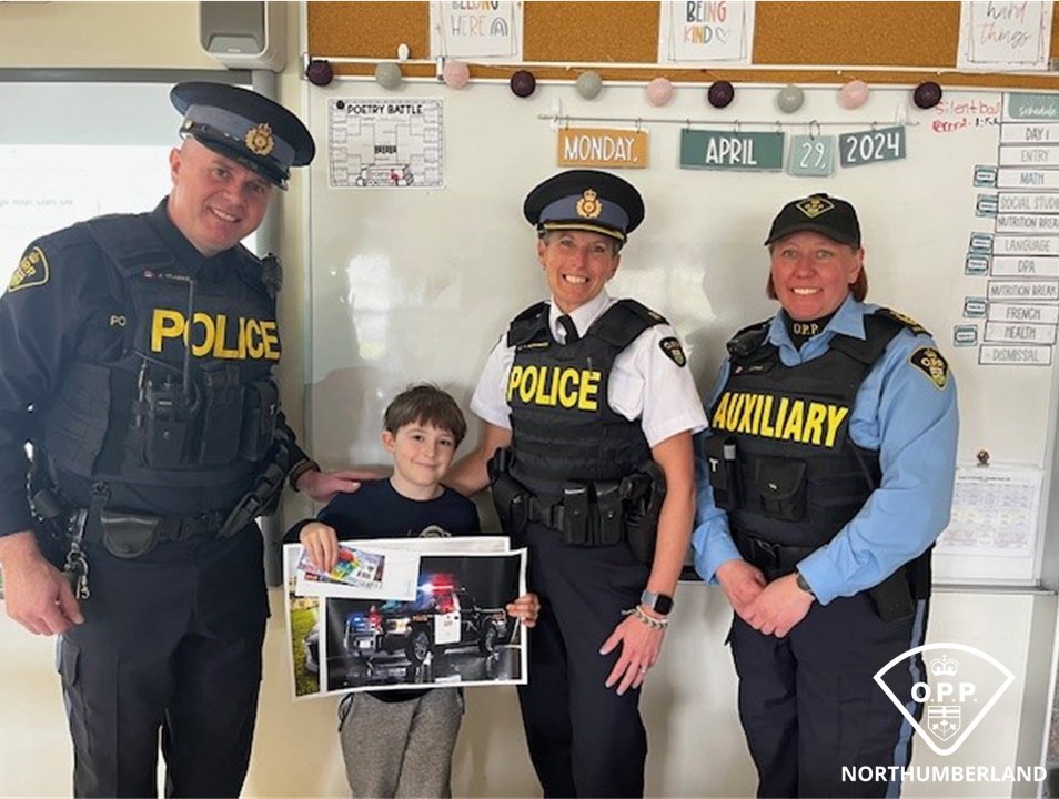 OPP_CR's tweet image. #NthldOPP Insp. McNaughton and Aux. S/Sgt. Myers presented a grade 3 student at Colborne PS with a positive ticket and some OPP items in recognition of bicycle safety and wearing his helmet while riding to school. Enjoy the free slushy! ^jc
