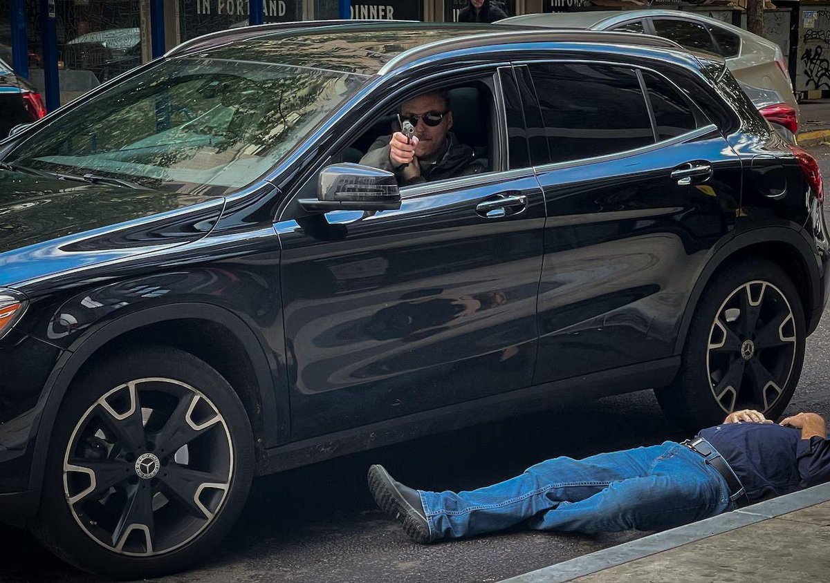 After a road rage shooting, a bystander snapped a pic of the assailant before being shot himself.