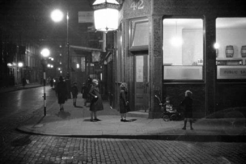 A photograph of Children waiting outside a London, pub, in 1938.