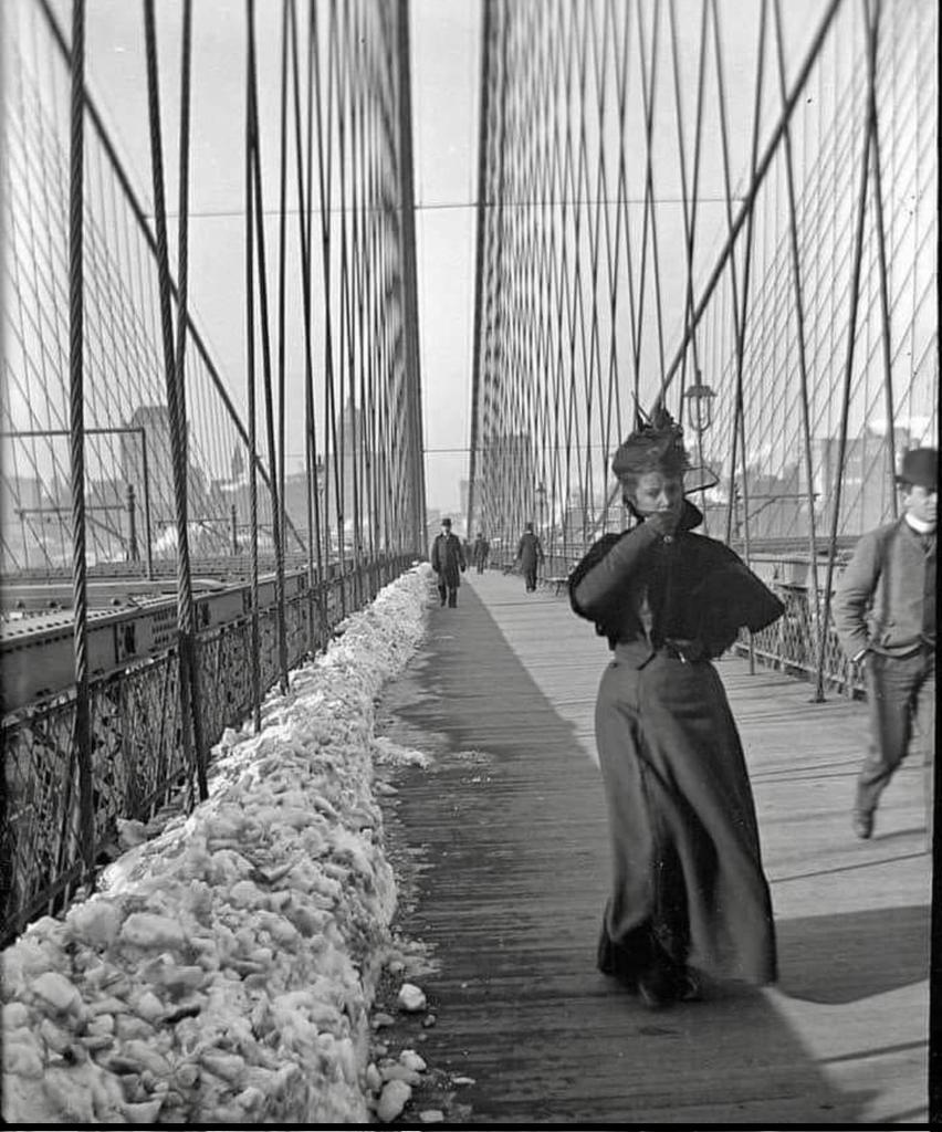 Winter stroll across the Brooklyn Bridge, 1890s.