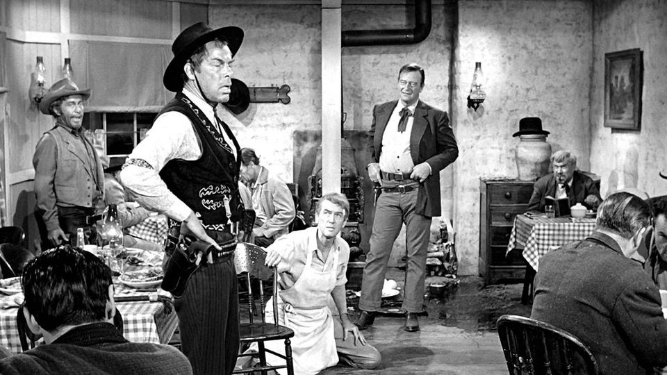 THE MAN WHO SHOT LIBERTY VALANCE 1962 Lee Marvin, Jimmy Stewart and John Wayne One of the best westerns ever made. Valance trips Pilgrim, who drops the Duke's steak on the floor... Tom Doniphon: 'Pilgrim, hold it. I said you, Valance; you pick it up.'
